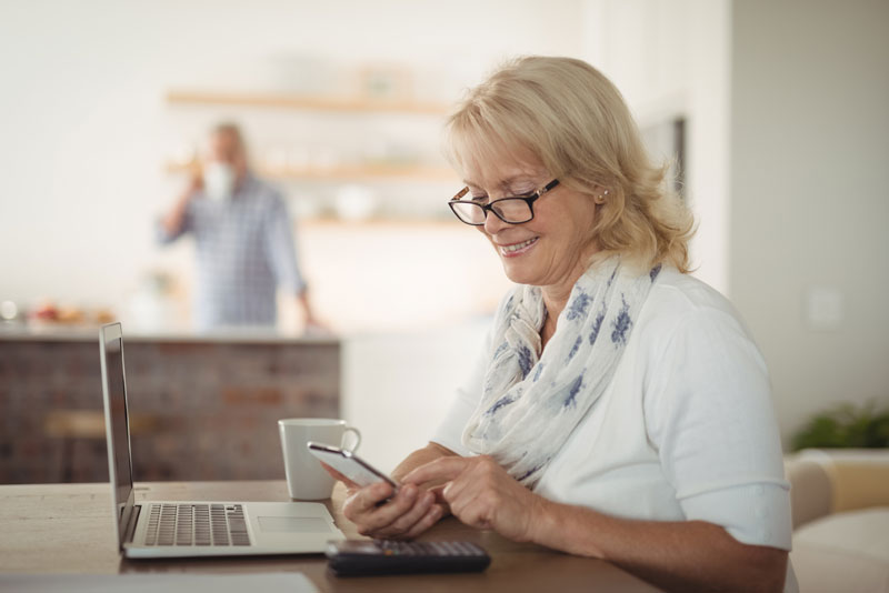 Patient smiling while going over the finances for their dental procedure