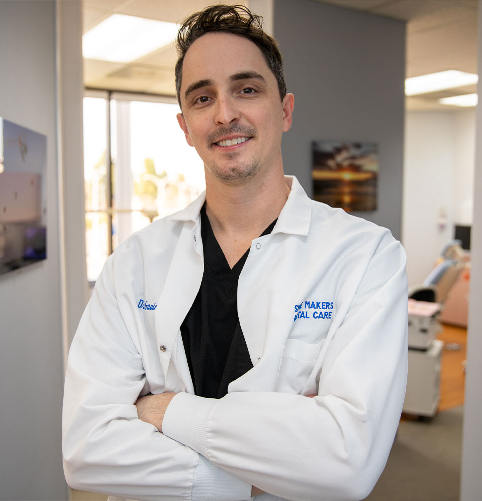 Doctor posing within the dental practice