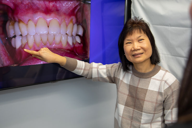 Patient going over information on their dental implant procedure