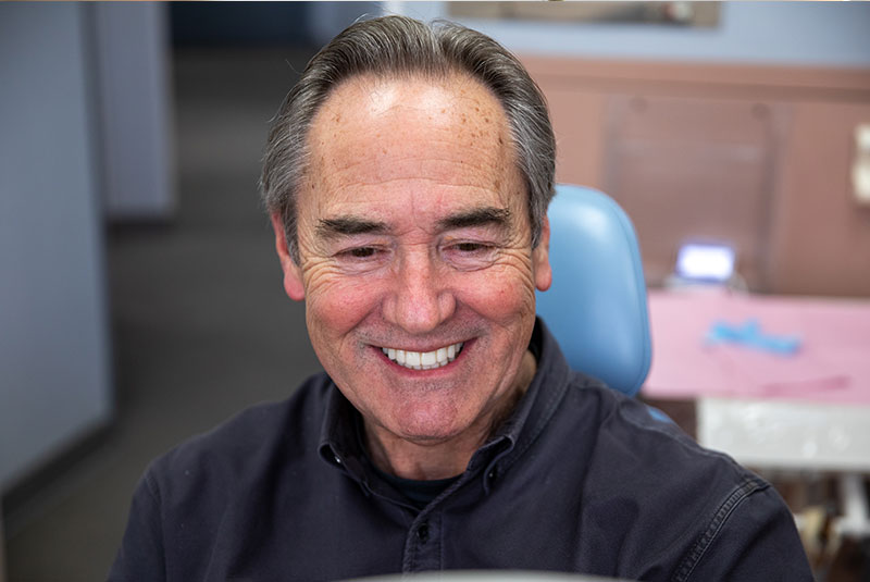 Patient smiling confidently after their dental procedure