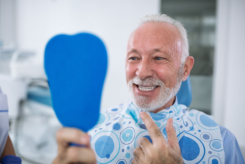 dental-implants-patient-smiling-after-procedure.